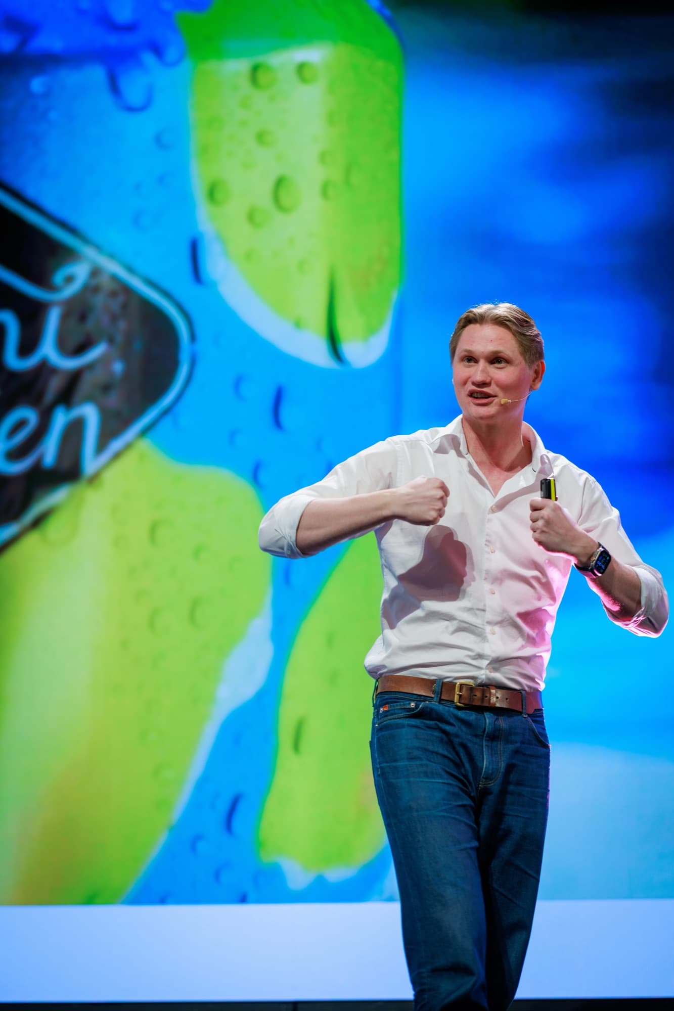 Anders Rodem speaking on a main stage